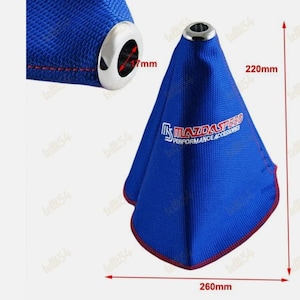 May include: Blue shift boot with red stitching and a silver metal ring. The boot has the text "Mazdaspeed Performance Accessories". The boot is 260mm wide and 220mm tall.