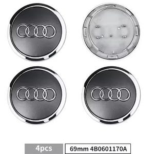 Könnte beinhalten: Vier schwarze und silberne Audi Radnabenabdeckungen. Jede Kappe zeigt das Audi-Logo mit vier ineinandergreifenden Ringen. Die Kappen sind rund mit silberner Umrandung. Der Text "4pcs" und "69mm 4B0601170A" sind sichtbar.