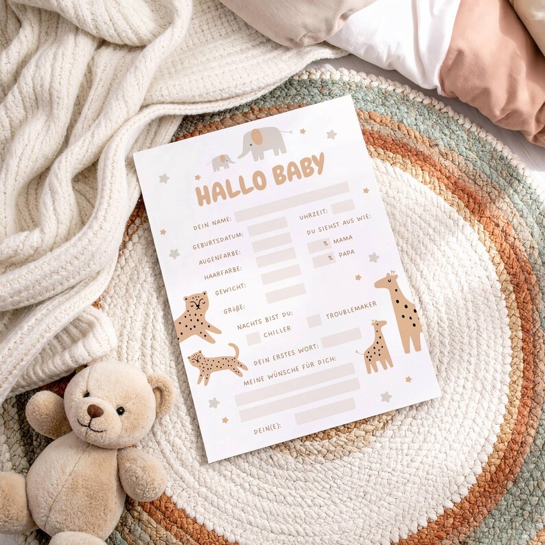 May include: A baby announcement card with the words "HALLO BABY" in a playful font. The card features illustrations of animals, including elephants, giraffes, and leopards. It has spaces to fill in baby's details.