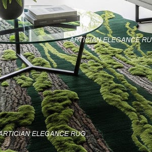 May include: A green and brown area rug with a tree bark and moss design. The rug has a dark green background with raised, textured areas in shades of green and brown. The text "ARTICIAN ELEGANCE RUG" is printed on the rug.