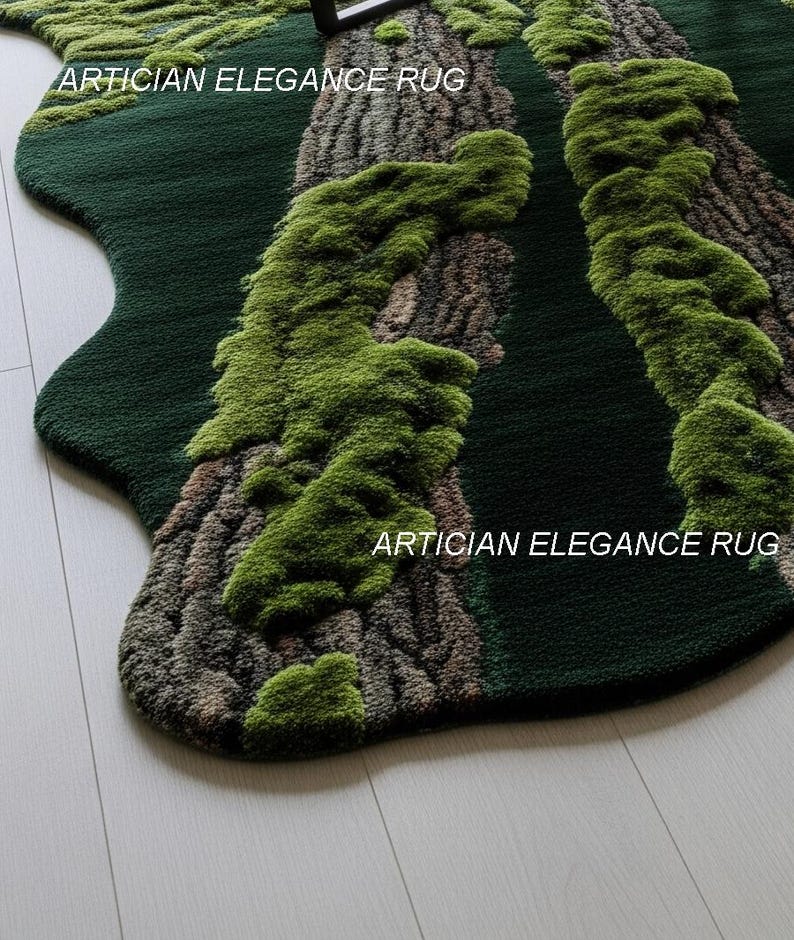 May include: A green rug with a unique design resembling a forest floor. The rug features a dark green base with raised, textured areas in shades of brown and green, mimicking tree trunks and moss. The text "ARTICIAN ELEGANCE RUG" is printed on the rug.