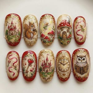 May include: A collection of ten hand-painted nail art designs. Each nail showcases a unique whimsical illustration, such as a castle, squirrel, fairy, mushroom house, and an owl reading. The nails have a red border with gold detailing.