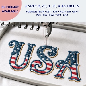 May include: An embroidery machine hoop holding white fabric with the stitched text USA in a flag pattern of blue, white, and red. Text above states: 6 SIZES: 5.08, 6.35, 7.62, 8.89, 10.16, 11.43 CM. FORMATS: BMP, DST, EXP, HUS, INF, JEF, PEC, PES, SEW, VP3, XXX.