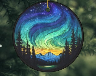 May include: A round Christmas ornament with a colorful stained glass design of a mountain landscape under a starry sky with a swirling aurora borealis.