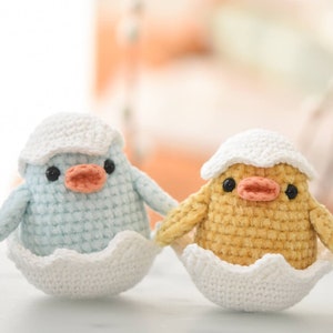 Little amigurumi chicks in an egg shell