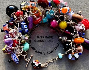 Lampwork glass charm bracelet multicoloured.