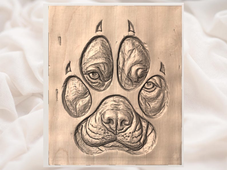 May include: A detailed wood carving of a dog paw print. The paw print is intricately carved, showing the pads, claws, and the dog's nose. The carving is in shades of brown and tan, with visible wood grain.