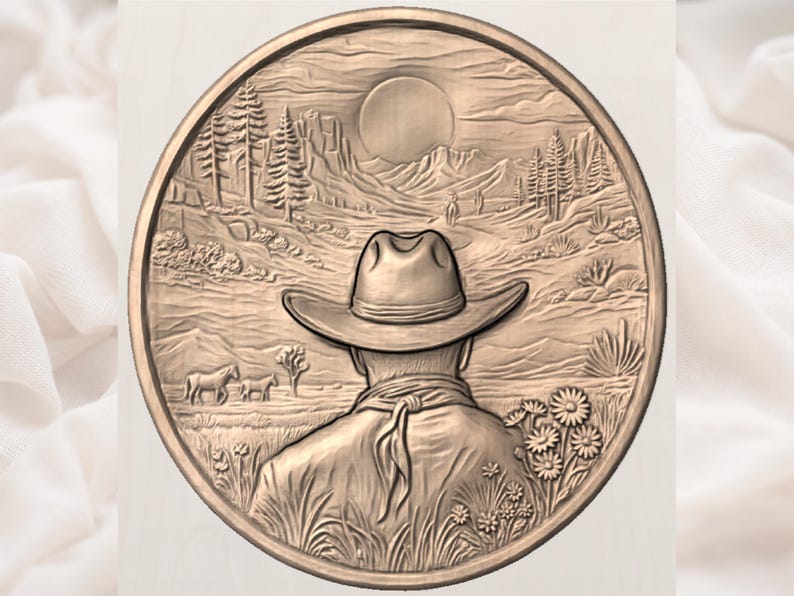 May include: A circular, bronze-coloured relief carving showing a cowboy in a hat, facing a desert landscape with mountains, trees, and a setting sun. The detailed carving includes horses, flowers, and a textured border, evoking a Western theme.