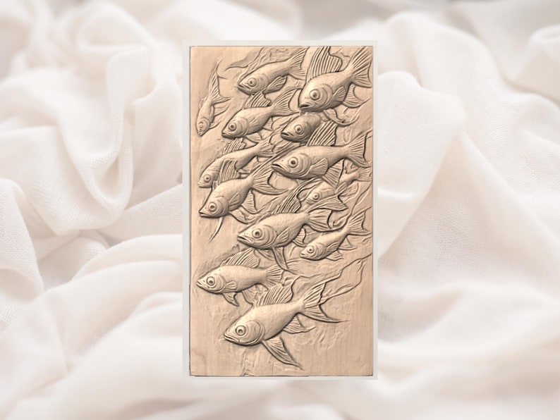 May include: A rectangular, light brown relief carving featuring a school of fish swimming upwards. The fish are detailed with fins and scales, creating a textured appearance. The background is a soft, off-white fabric.