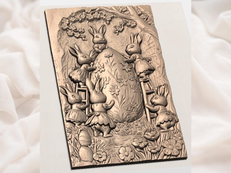 May include: A carved wooden relief depicting six rabbits gathered around a large, decorated egg. The rabbits are dressed in skirts and are interacting with the egg, some using a ladder. The scene is set in a garden with flowers and a tree.