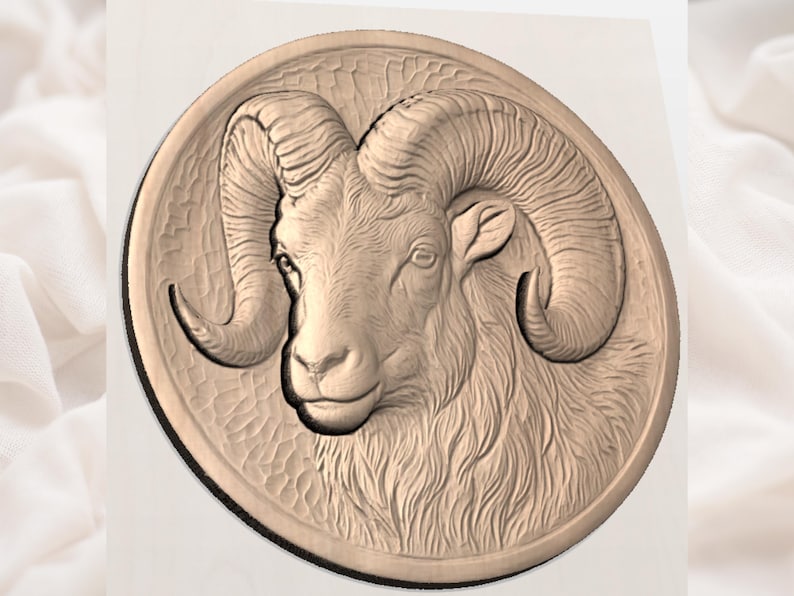 May include: A detailed, circular relief carving of a ram's head. The ram has large, curved horns and a textured coat. The carving is in a warm, neutral tone, suggesting wood or a similar material. The ram's face is centered, with a focus on its features.