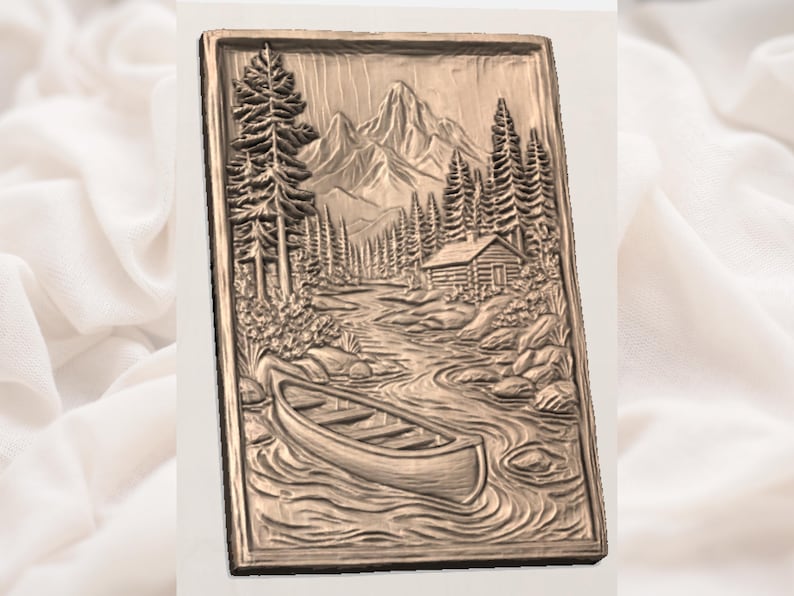 May include: A rectangular relief carving showing a mountain landscape with a river, canoe, cabin, and pine trees. The artwork is in shades of brown, creating a rustic aesthetic. The carving is a detailed representation of a natural scene.
