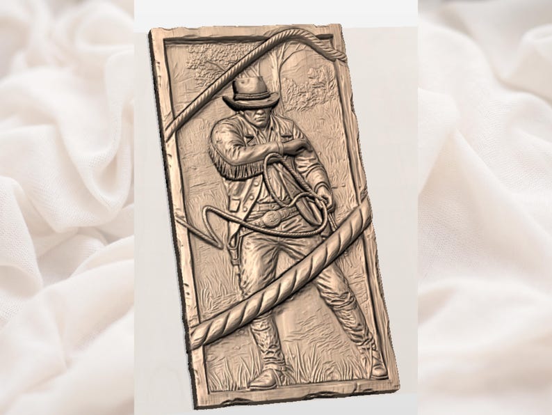 May include: A bronze-colored relief carving of a figure in a hat and jacket, holding a whip. The carving is framed by a rope design and set against a backdrop of trees. The figure is in a dynamic pose, suggesting action.