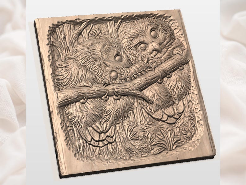 May include: A wooden relief carving of two owls perched on a branch. The owls are detailed with textured feathers and large eyes. The carving is set within a rectangular frame, showcasing a nature-themed artwork.