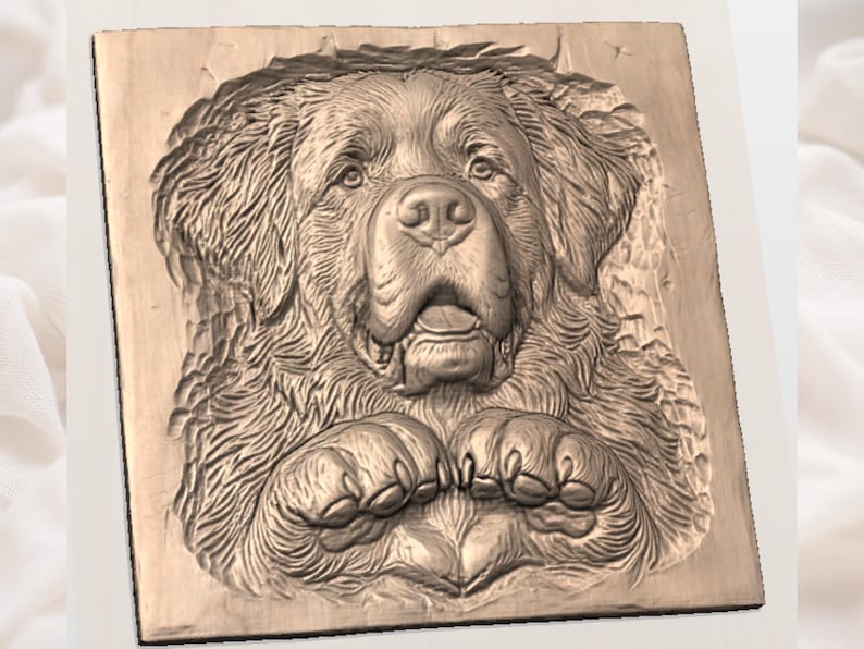 Detailed CNC bas-relief wood carving on a dark walnut block. Features a lifelike, front-facing bust of a St. Bernard dog with detailed fur texture, characteristic drooping eyes, and floppy ears. The dog’s large front paws, complete with prominent claws, are resting below its chin. The carving is deeply set into the block, showcasing the natural wood grain and a rustic, chiseled surrounding edge.