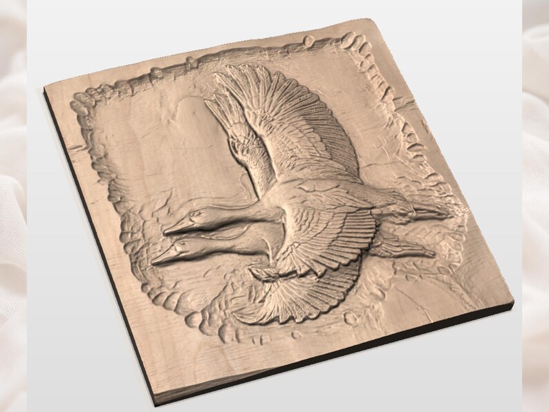 May include: A wooden relief carving of two geese in flight. The birds are depicted with detailed wing feathers and are set against a textured background. The artwork is mounted on a square wooden panel.