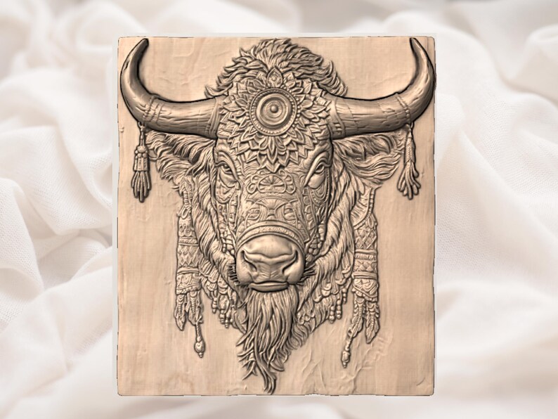 May include: A detailed, carved wooden panel featuring a bison head. The bison has large curved horns, intricate facial details, and decorative elements. The artwork is in shades of brown and beige, with a focus on texture and depth.