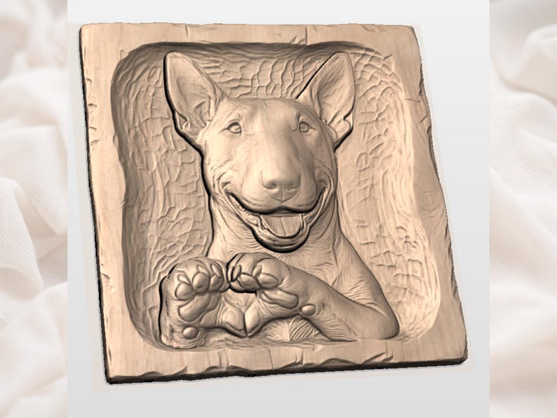 May include: A wooden relief carving of a Bull Terrier dog. The dog is smiling with its tongue out, and its paws are crossed. The carving is in a rectangular shape with a textured background and a light brown color.