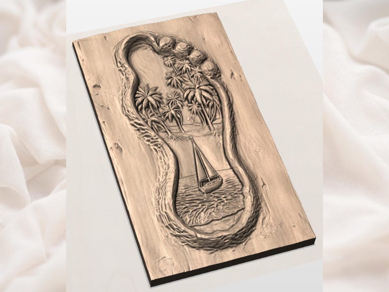 May include: A wooden carving of a foot with a beach scene inside. The scene includes palm trees, ocean waves, and a sailboat. The carving is rectangular and has a natural wood color.