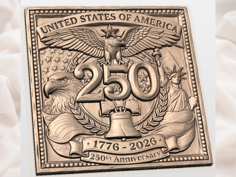 May include: A detailed, bronze-colored relief sculpture commemorating the 250th anniversary of the United States of America. The design includes an eagle, the Statue of Liberty, stars, and the Liberty Bell, with the text "UNITED STATES OF AMERICA" and "1776-2026 250th Anniversary".