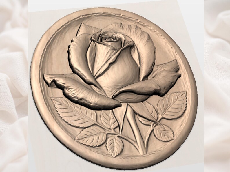 May include: A detailed relief carving of a rose in full bloom, set within an oval frame. The rose has multiple petals and is surrounded by leaves. The carving is in a warm, neutral tone, suggesting wood or a similar material.