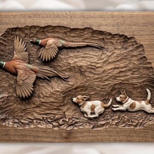 May include: A wooden relief carving featuring two pheasants in flight above two dogs. The birds have brown, red, and green plumage. The dogs are white with brown spots. The background is textured and carved to resemble a natural landscape.