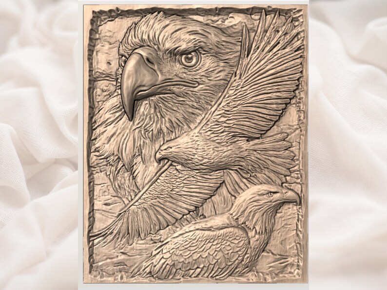 May include: A detailed relief carving of three eagles. The central eagle is in profile, with a sharp beak and intense gaze. Two additional eagles are depicted in flight, with outstretched wings. The artwork is framed and has a natural wood-like appearance.