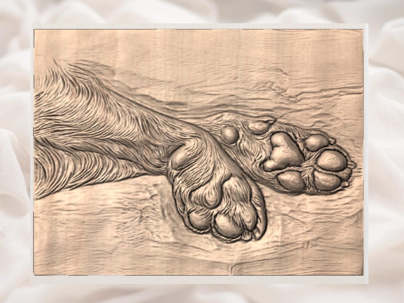 May include: A detailed wooden carving of a dog's paw pads and fur. The artwork is in a natural wood tone, showcasing the texture of the fur and the pads' shape. The image is framed with a white border.