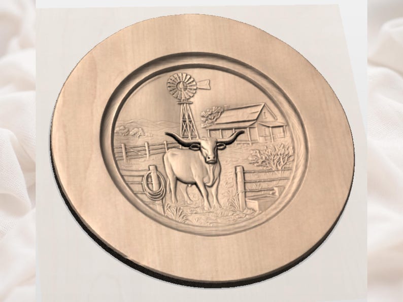 May include: A circular wooden plate featuring a carved relief of a rural scene. The design includes a longhorn steer, a windmill, a barn, and a fence. The plate is light brown and has a raised edge. The scene is reminiscent of a farm.