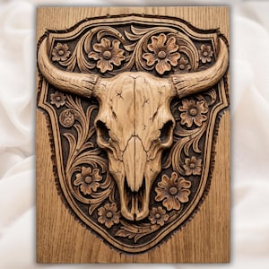 May include: A wooden wall art piece featuring a carved bull skull with long horns, set against a floral and shield-shaped background. The artwork is in shades of brown and tan, with detailed floral patterns.