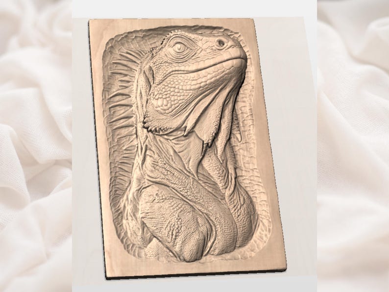 May include: A detailed wood carving of an iguana's head and upper body. The iguana is carved in relief on a rectangular wooden plaque. The carving showcases the iguana's textured skin and facial features, with a focus on the eye.