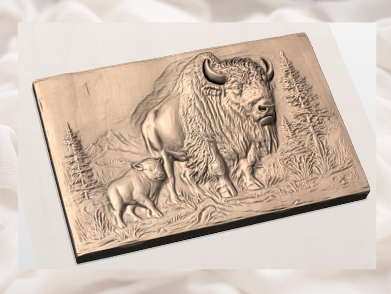 May include: A rectangular wooden relief carving depicting a bison and its calf in a natural landscape. The bison is large and detailed, with a shaggy mane and curved horns. The calf stands beside it. Trees and mountains are in the background.