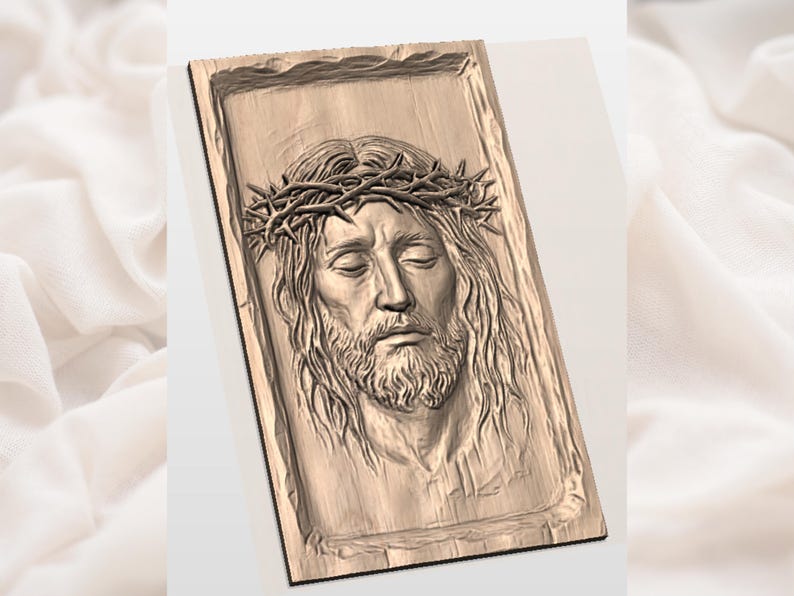 May include: A wooden relief carving of a man with long hair, a beard, and a crown of thorns. The carving is rectangular with a textured border and a light brown color. The man's eyes are closed, and his expression is serene.