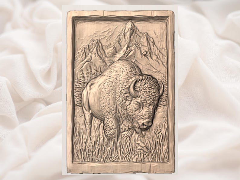 May include: A detailed wood carving of a bison in a grassy field, with mountains and trees in the background. The relief sculpture is framed in a rectangular border. The bison is the focal point, with textured fur and horns.