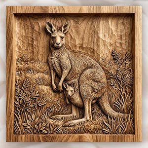 May include: A square wooden wall plaque featuring a detailed relief carving of a kangaroo with a joey in its pouch. The scene depicts the animals standing in a grassy field with textured foliage and a rocky background, all rendered in natural wood.