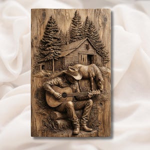 May include: A wooden relief carving depicting a cowboy playing a guitar in front of a barn and a horse. The artwork is in shades of brown, with detailed textures of wood grain and the figures.