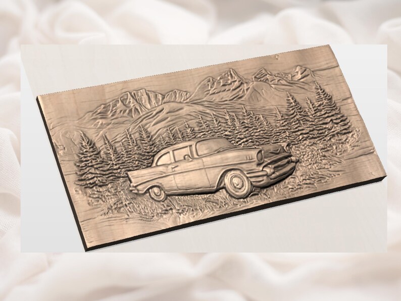 May include: A wooden relief carving of a classic car set in a mountain landscape. The artwork shows a detailed depiction of a vintage car, pine trees, and a mountain range. The carving is in shades of brown.