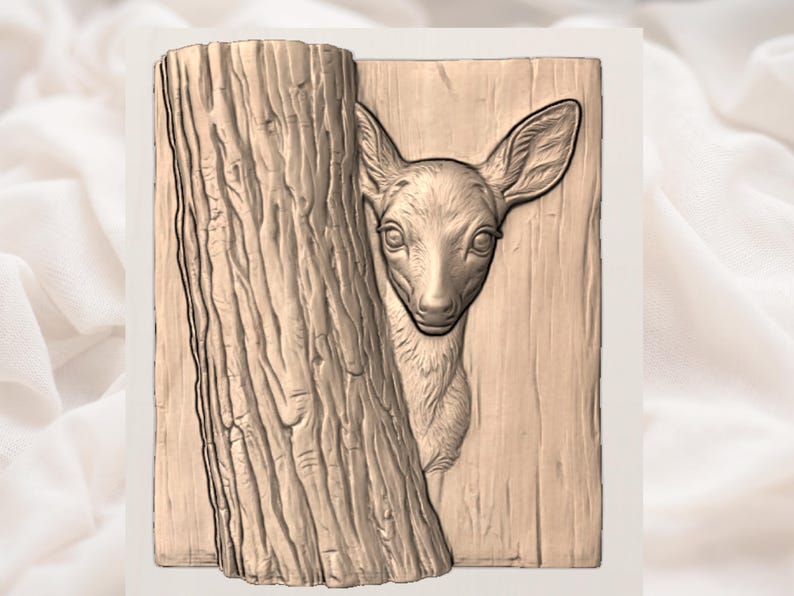May include: A detailed relief carving of a deer peeking from behind a tree trunk. The artwork is in a natural wood tone, with the deer's features and the tree's bark intricately carved. The deer has large ears and a gentle expression.