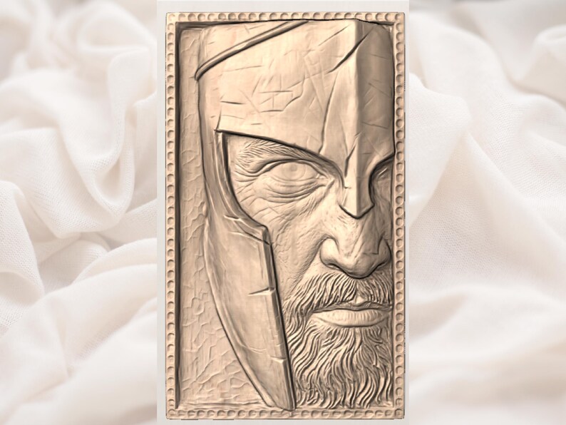 May include: A rectangular, relief carving of a man's face, featuring a helmet and a long beard. The carving is in a light brown color and has a detailed, textured surface. The man's face is partially visible, with a stern expression.