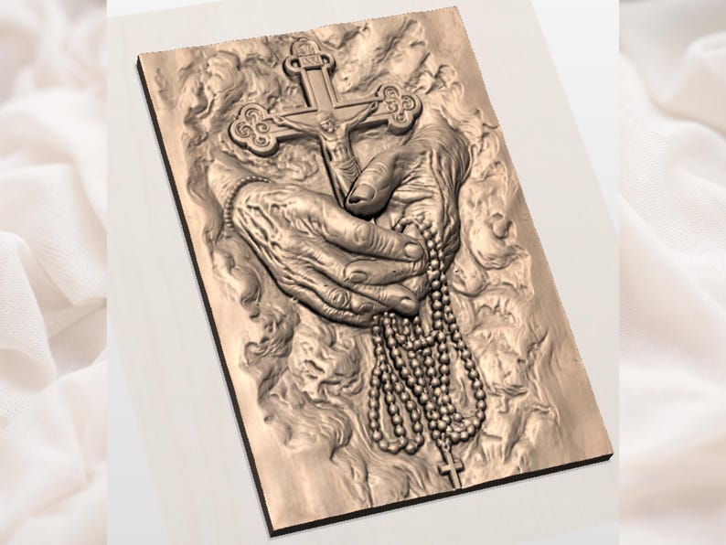 May include: A detailed relief carving of hands holding a crucifix and a rosary. The hands are intricately sculpted, with visible veins and wrinkles. The crucifix features a figure of Jesus. The rosary beads hang down, and the carving is set on a rectangular plaque.