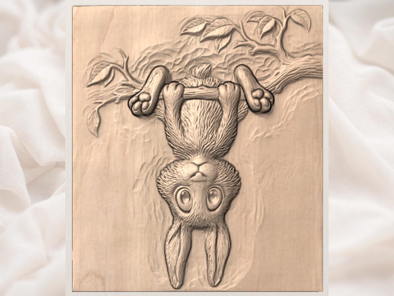 May include: A wooden carving of a rabbit hanging upside down from a tree branch. The rabbit has large eyes and is detailed with fur and paw pads. The tree branch has leaves and is also carved from wood.