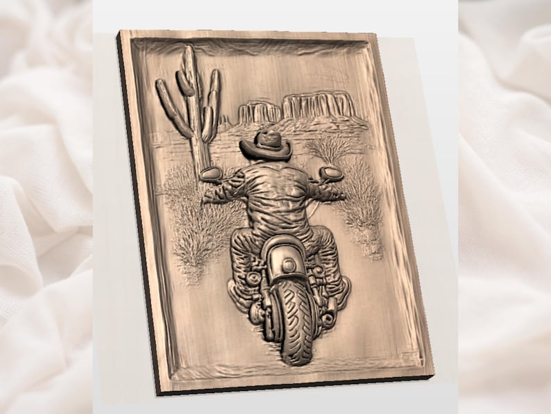 May include: A wooden relief carving showing a cowboy on a motorcycle in a desert scene. The carving features a detailed image of a rider wearing a cowboy hat, riding a motorcycle, with a cactus and mountains in the background.