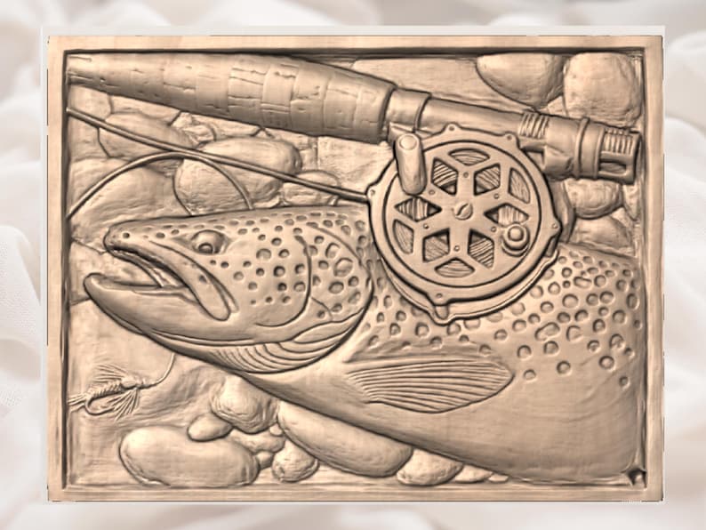 May include: A bronze relief carving depicting a trout, fishing rod, and reel. The fish is detailed with spots and scales, and the rod and reel are positioned above it. The background includes rocks and a fly.