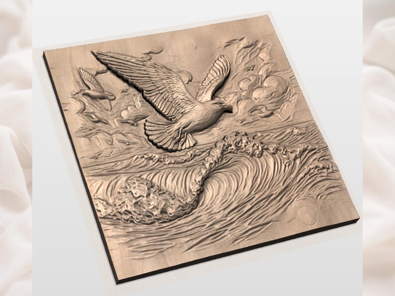 May include: A wooden relief carving of a seagull in flight over ocean waves. The artwork is detailed, with the bird's wings spread wide and the waves depicted with textured lines. The piece is mounted on a square wooden panel.