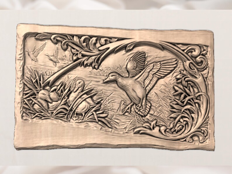 May include: A rectangular, light brown relief carving depicting ducks in a marsh setting. The detailed artwork shows ducks in flight and at rest, surrounded by reeds and foliage. The border features ornate, swirling designs.