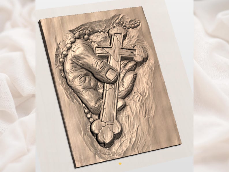 May include: A wooden relief carving depicting a hand holding a cross. The hand is detailed with visible veins and wrinkles, and a rosary is draped around the cross. The carving is set against a textured background, with a warm, natural wood tone.