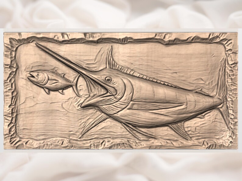 May include: A wooden relief carving of a marlin chasing a smaller fish. The marlin has a long, pointed bill and is depicted in a dynamic pose. The carving is framed by a textured border and has a natural wood tone.
