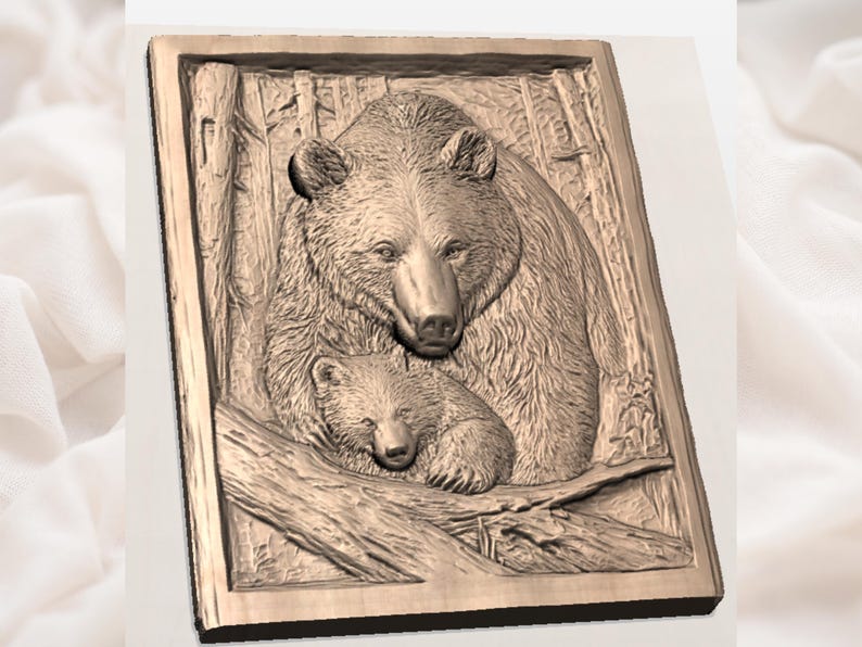 May include: A rectangular, bronze-coloured relief carving depicts a mother bear and her cub nestled together. The detailed artwork shows the bears in a forest setting, with tree trunks visible in the background. The carving is framed by a simple border.