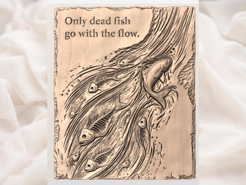 May include: A rectangular, bronze-coloured plaque with the carved phrase "Only dead fish go with the flow." The plaque features a detailed relief of fish skeletons and a live fish swimming against a current.