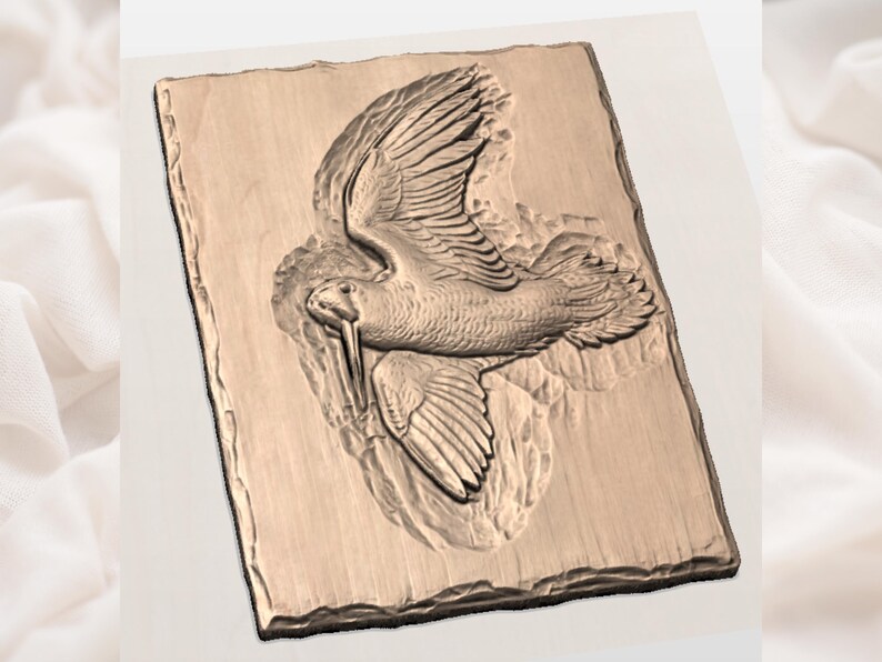 May include: A rectangular, light brown relief carving of a bird in flight. The bird has detailed wings and a long beak, set against a textured background. The carving is mounted on a rectangular base with a rough, stone-like edge.